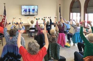 photo of people doing chair exercises
